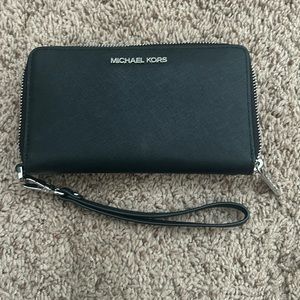 Lightly used black Michael Kors wallet with silver accents